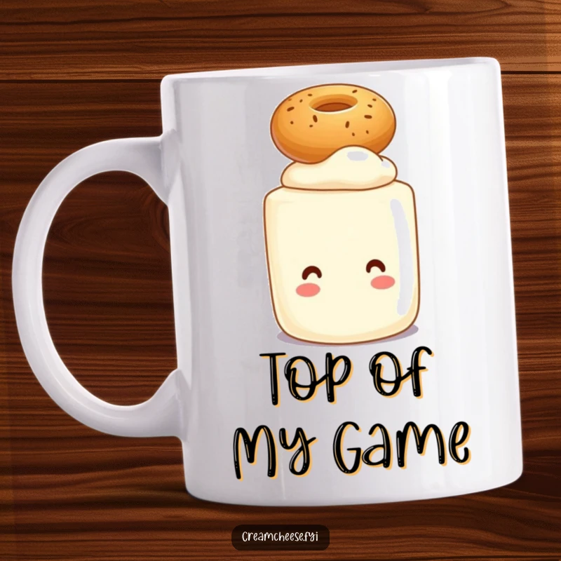 Funny mug with a smiling cream cheese tub character perfectly balancing a tiny bagel on its head, celebrating breakfast.