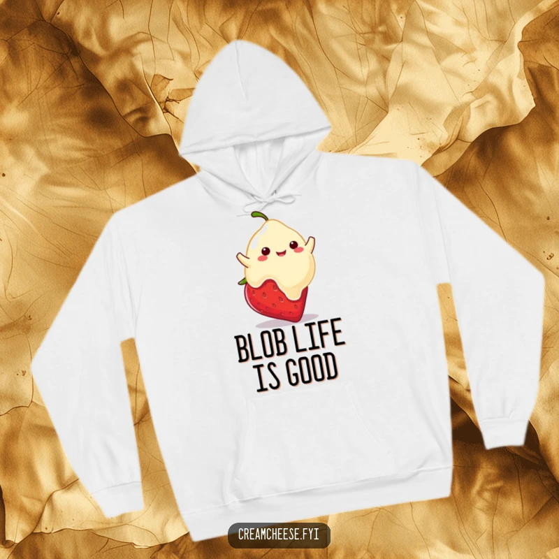 Funny hoodie with a playful cream cheese blob happily bouncing on a strawberry, radiating sweet, delightful energy.
