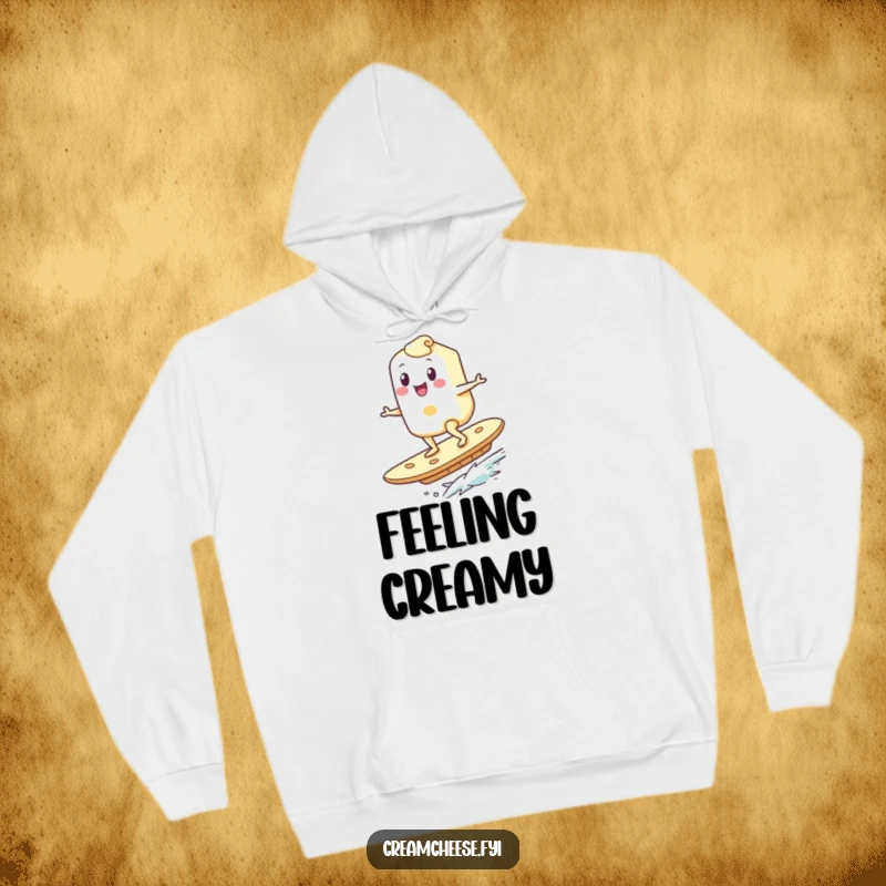 Funny Cream Cheese Hoodie: A happy cream cheese character surfs with glee on a giant cracker, embodying a fun and adventurous breakfast experience.