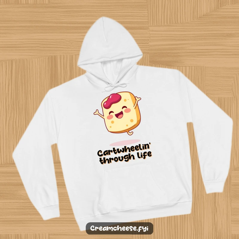 Funny cream cheese slice hoodie doing a joyful cartwheel with a dollop of jam, cozy and full of breakfast cheer.