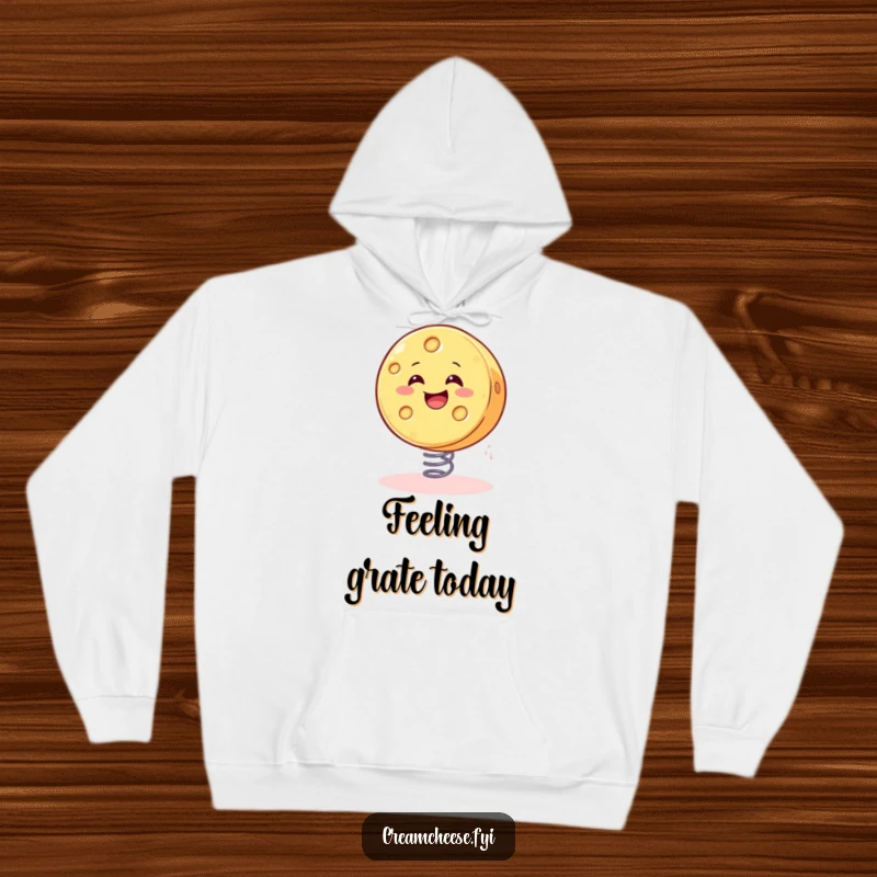 Funny cheese hoodie design of a smiling wheel of cheese gleefully bouncing on a spring, embodying pure fun.