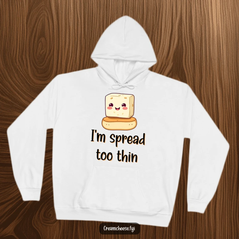 Funny cream cheese cube precariously balancing on a bagel, depicted on a cozy hoodie. A whimsical and funny breakfast illustration, perfect as a funny gift.