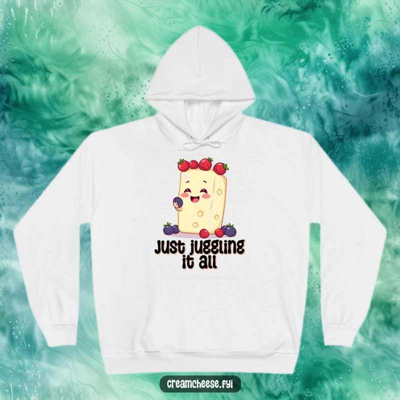 Funny cream cheese character smiling wide while expertly juggling a handful of bright berries, featured on a cozy hoodie.
