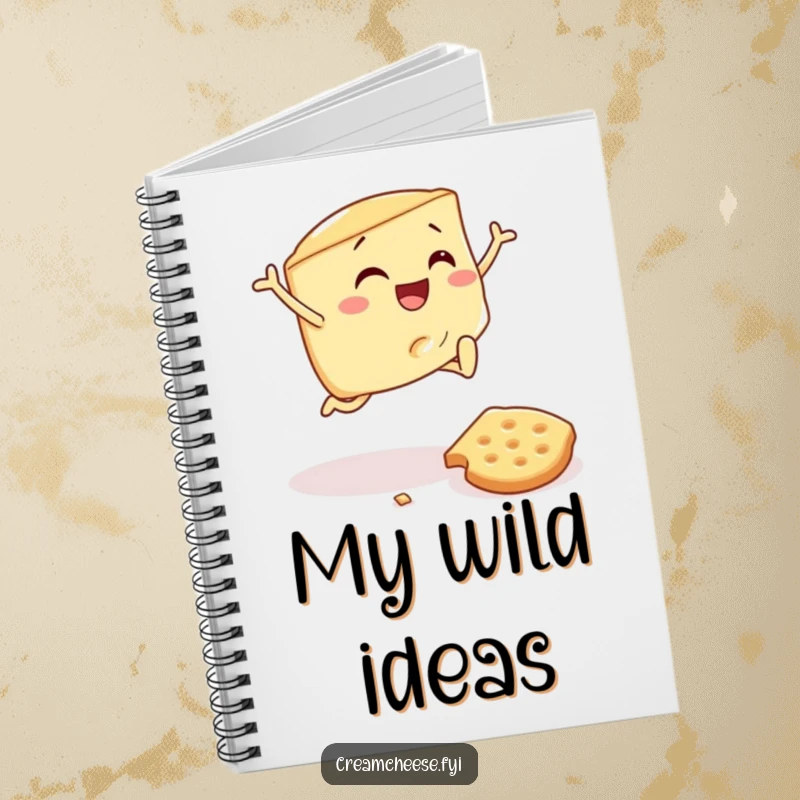 Funny notebook cover with a cream cheese wedge joyfully leaping a fallen cracker, encouraging creative thoughts and breakfast-themed doodles.