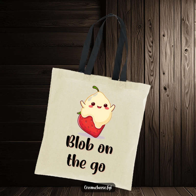 Funny tote bag with a playful cream cheese blob happily bouncing on a ripe strawberry, a sweet and delightful accessory.