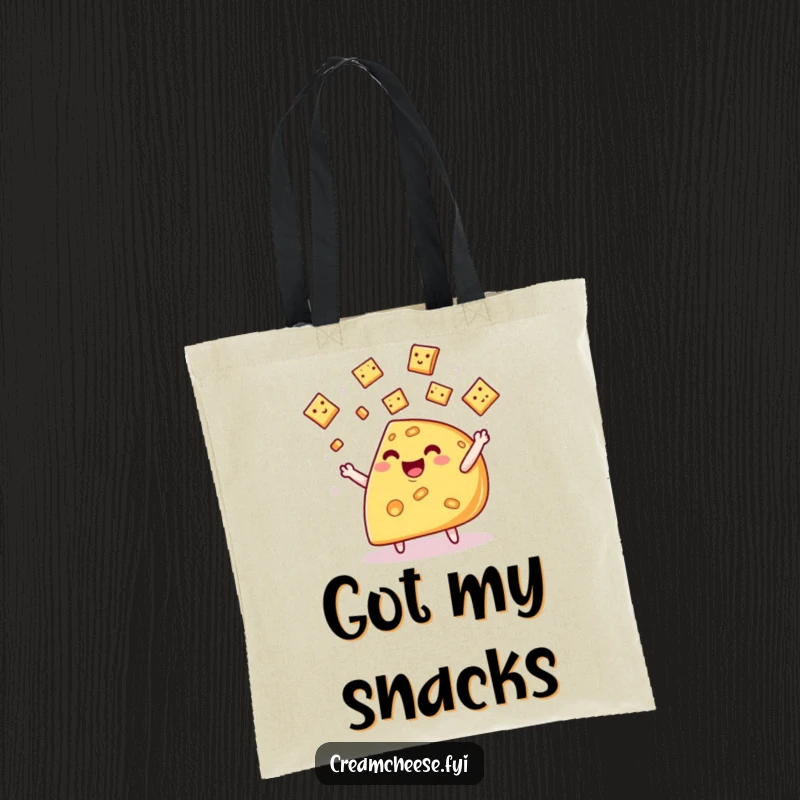 Funny cheese wedge tote bag, featuring a whimsical character joyfully juggling miniature crackers with a delightful expression.